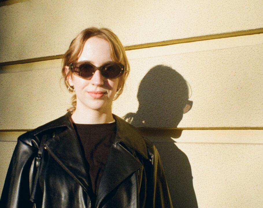 woman in black leather jacket and black sunglasses in sunlight