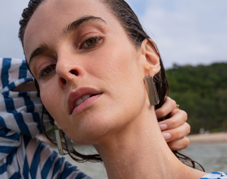 Close up of a young woman on the beach.