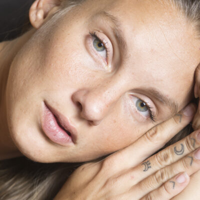 woman laying down looking at camera