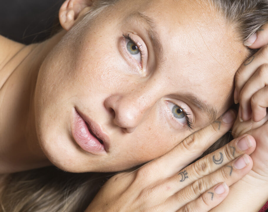 woman laying down looking at camera