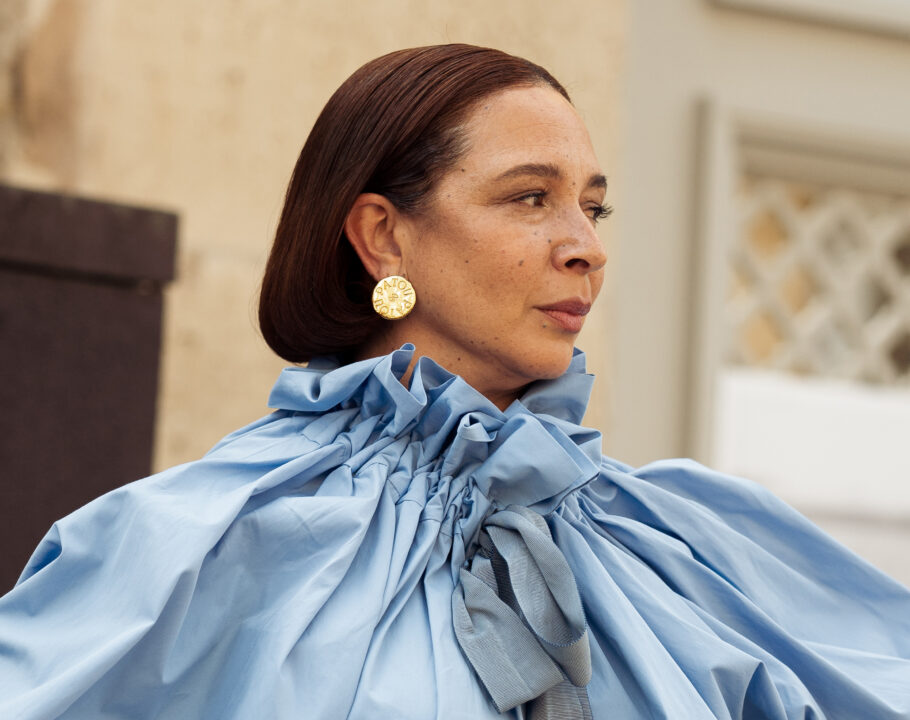 Maya Rudolph wears a long, light blue puffy sleeved dress outside