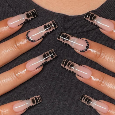 A close up of French manicure nails featuring a crocodile print and rhinestone nail art.