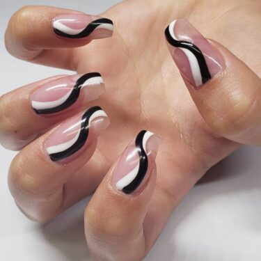 close-up of swirl design on square nails