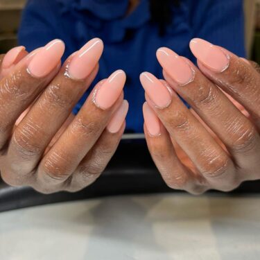 a close-up of nude oval nails