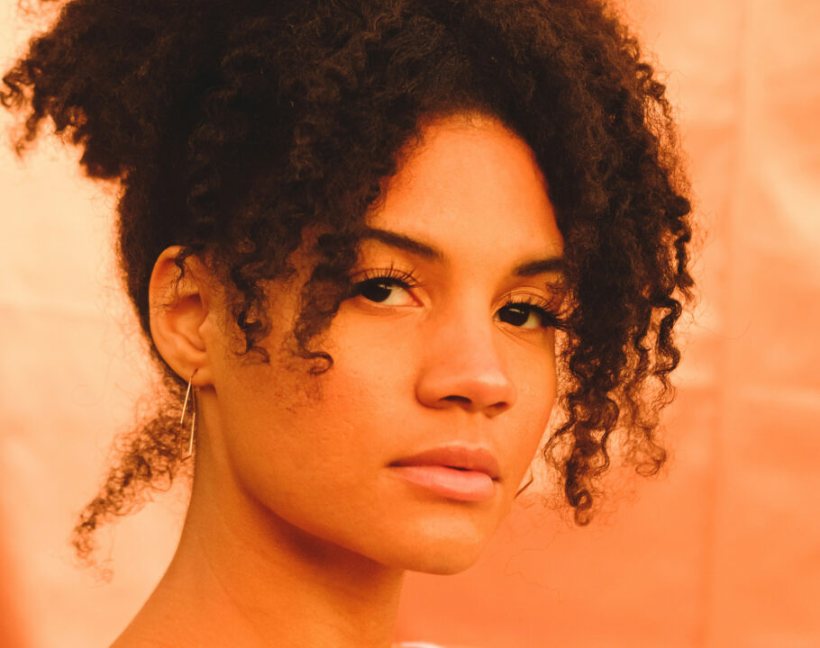 Dark-skinned woman with curly hair