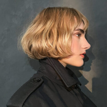 on the left, a side profile of a woman with a short bob