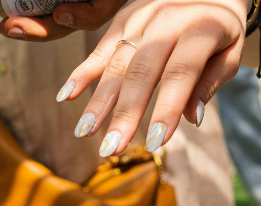 woman showing off manicured finger nails