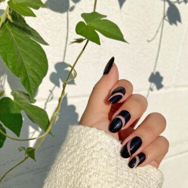 black contrast swirl nails