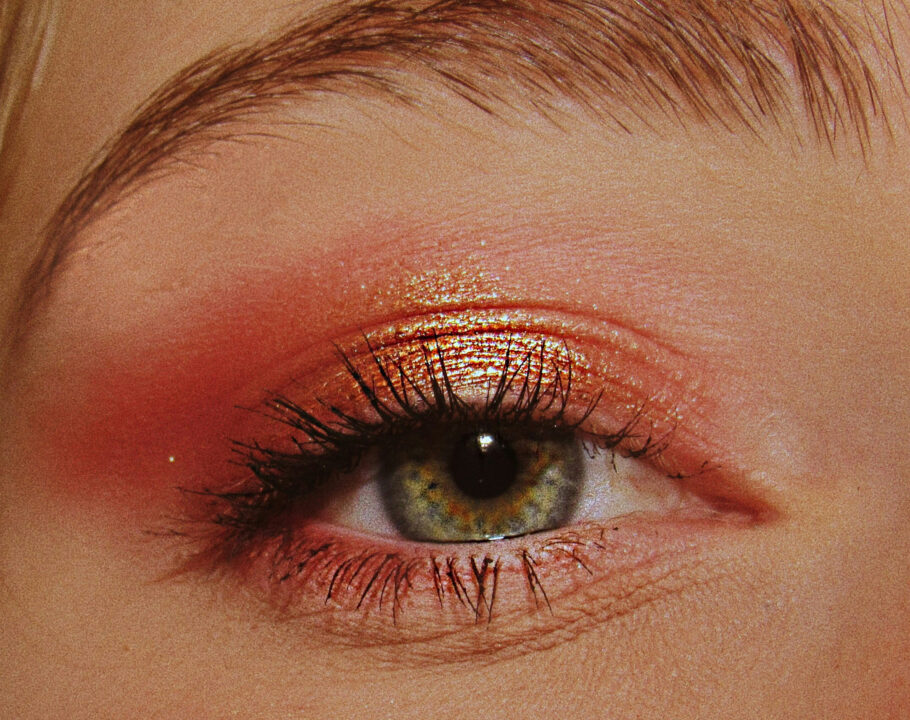 Zoomed in photo of woman wearing pink glitter eye shadow