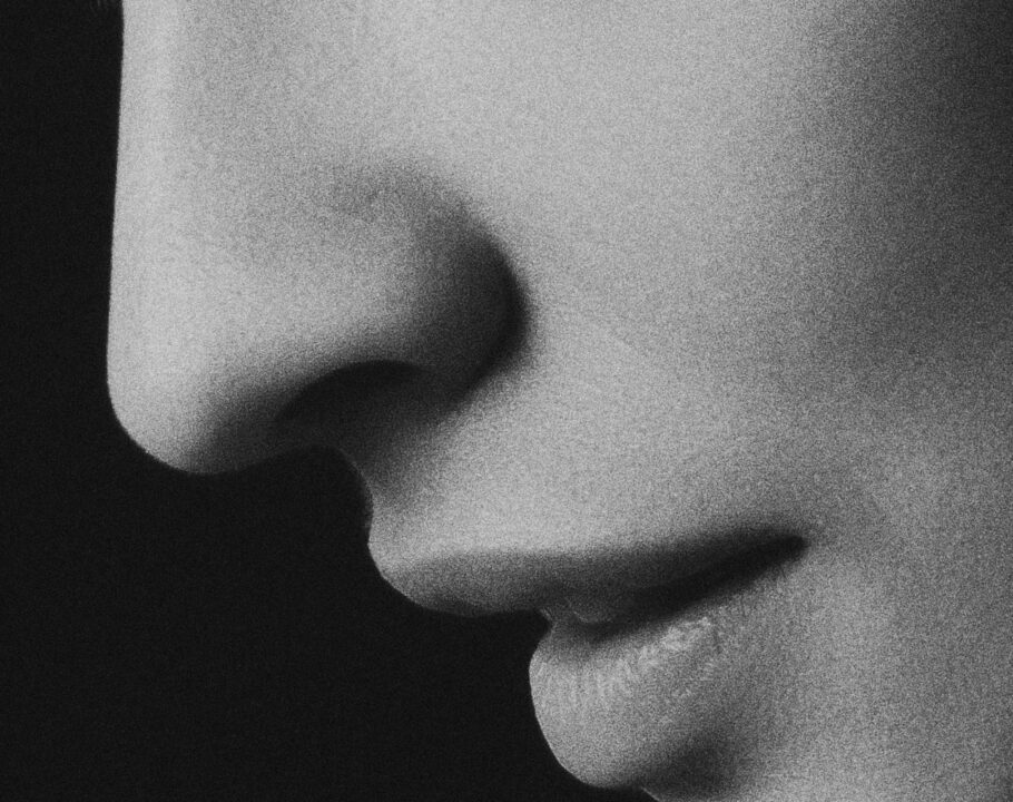 black and white photo of woman's nose and lips