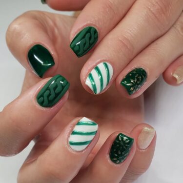 Short nails with festive green and white designs