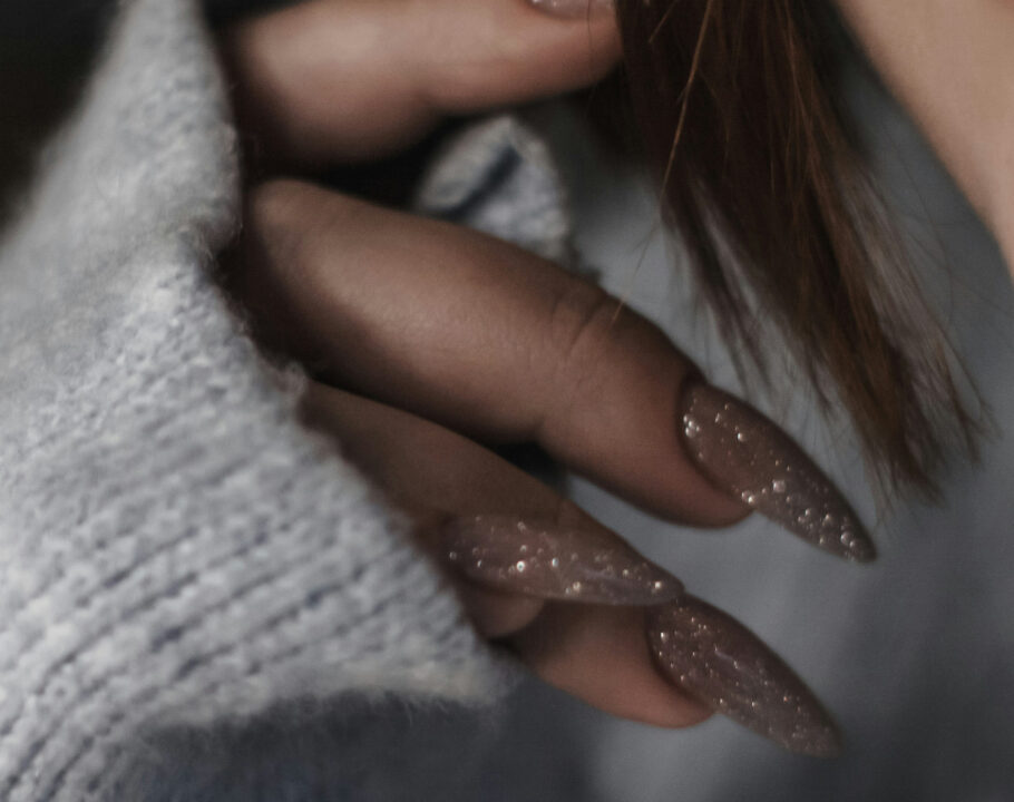 close up of woman's glittery long nails